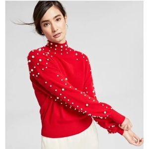 Cashmere red sweater with pearls.